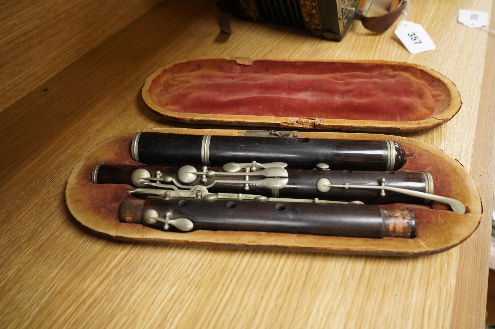 A 19th century cased ebony flute, with ten key system, unsigned, the case af